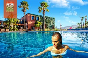 Girl swimming in the hotel pool